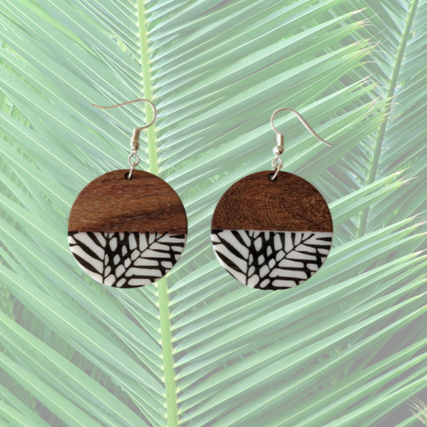 Disc Earring with wood and white resin with black leaf pattern.