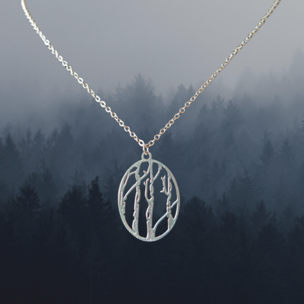 birch tree necklace over woods